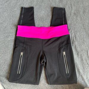 Black Lululemon leggings with pink details